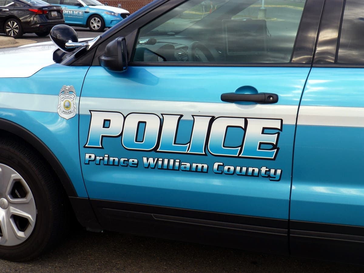 A woman's car was hit by gunfire exchanged at a Woodbridge intersection over the weekend, according to Prince William County Police. 