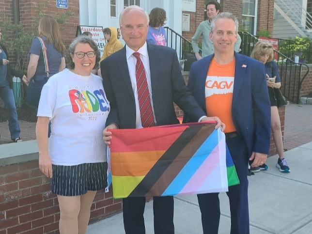 Alisa Trachtenberg, chairperson of Ridgefield CT Pride, Ridgefield’s first selectman, Rudy Marconi and Jeremey Stein of CT Against Gun Violence pose with the Pride Progress Flag before the start of the ceremony.