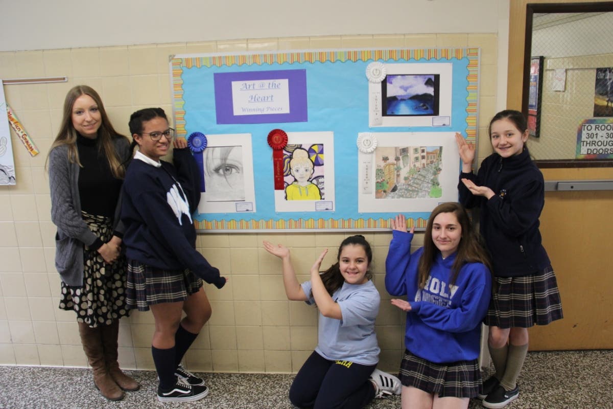 Students show off their artwork.