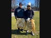 Westfield residents Joe and Helen Armstrong pose with trash bags showcasing the message “Leave It Better Than You Found It.” The bags were donated by the Madewell store at Garden State Plaza.