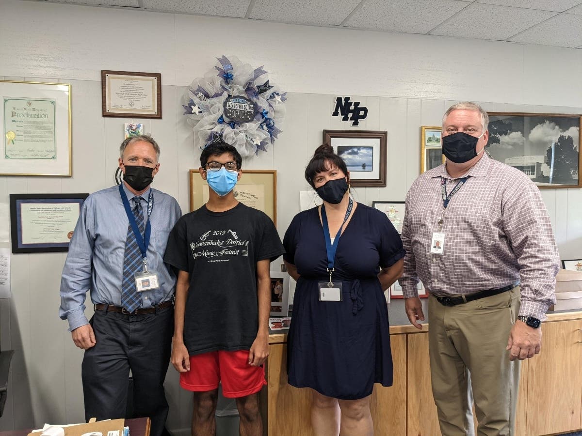 New Hyde Park Memorial High School student Izhaan Ahmed is pictured
with (from L to R) Music Chairperson and District Music Coordinator Noel Monat, band
teacher Hope Bagley, and Principal Dr. Richard Faccio.