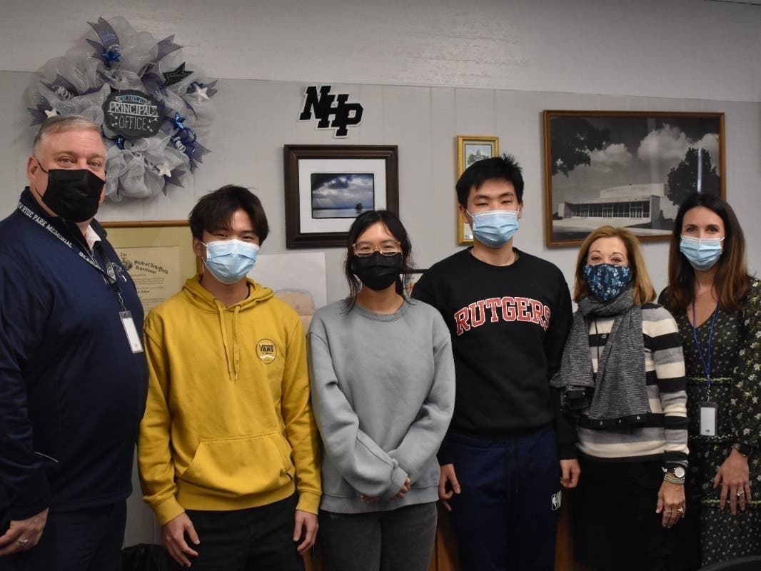 From L to R: New Hyde Park Memorial High School Principal Dr. Richard
Faccio, Laurence Lai, Emma Ouyang, Daniel Kim, Guidance Chairperson Gerri Cookler, and
Guidance Counselor Michele Pesce.