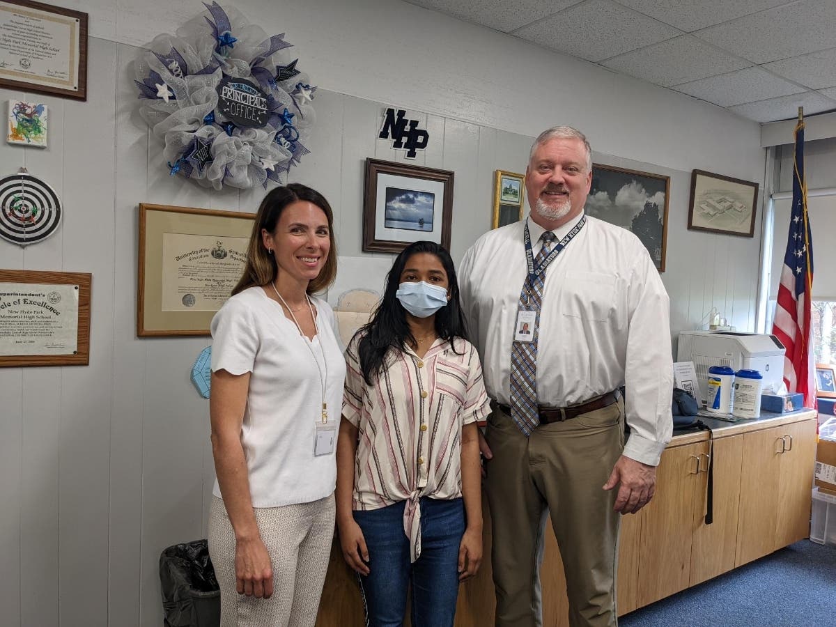 New Hyde Park Memorial High School student Anitta Kottai, center, is
pictured with guidance counselor Michele Pesce and principal Dr. Richard Faccio.