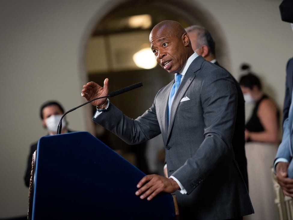 Mayor Eric Adams, seen here at a City Hall press conference, announced another $8 million for homeless outreach volunteers.