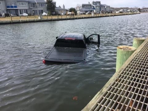 A man who suffered a medical episode drove his pick-up truck into the water in Patchogue on Monday, Suffolk police said. He was rescued by officer Daniel Elitharp.