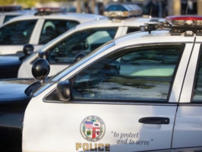 The officers were injured after they confronted and exchanged gunfire with the suspect in the area of 135th Street and Broadway around 9 p.m. Wednesday, the LAPD said.