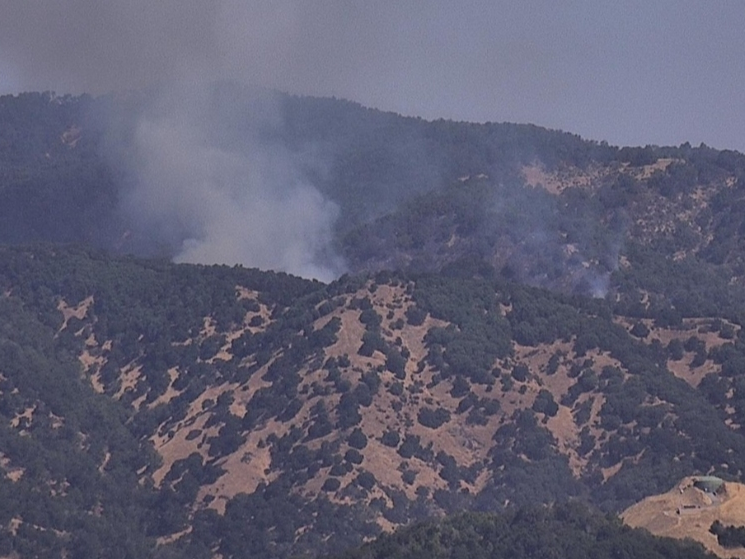 Footage captured by a PG&E camera showed smoke billowing from a vegetation fire Tuesday near Marinwood.