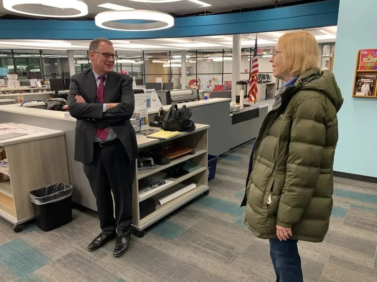 Michael Lach, incoming superintendent of Hinsdale High School District 86, speaks with resident Linda Burke in January at a meet-and-greet at Hinsdale Central High School's library. 