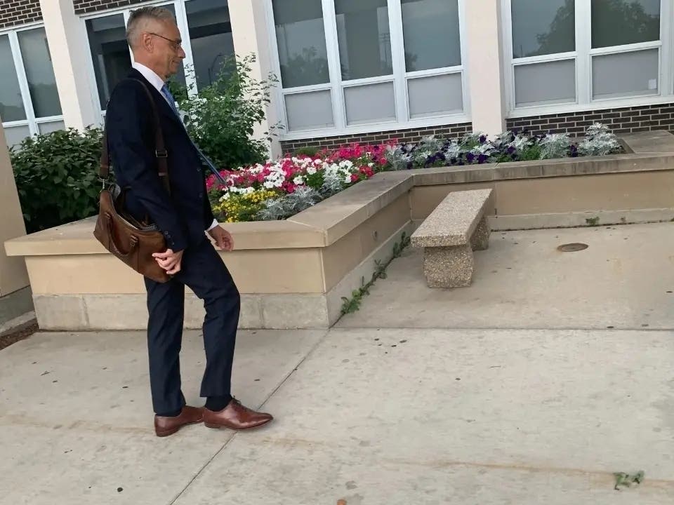 Joseph Perkoski, an attorney with the Robbins Schwartz law firm, enters Hinsdale South High School earlier this summer to attend a closed school board meeting. He has been the main attorney advising the board. 