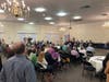 Jennifer Rose, the executive director of the Central Fairfax Chamber of Commerce, welcomed attendees to Wednesday night's Candidate Meet & Greet at American Legion Post #177.