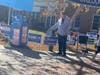 This photo taken on Saturday afternoon by Liam Fischer, the vice president of the Democrats at Mason, shows Matt Stoeckel of Executive Press Inc. handing out the blue Independent/Non-Partisan Sample Ballot outside City Hall.