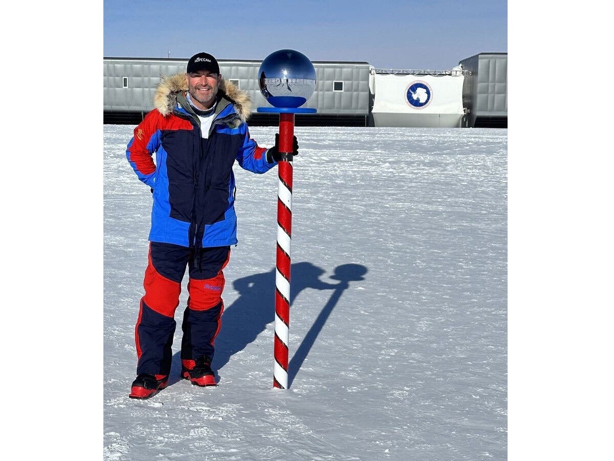 After an airplane dropped off on the Antarctic plateau, Len Forkas and his team skied 60 nautical miles over seven days to reach the Amundsen-Scott South Pole Station.