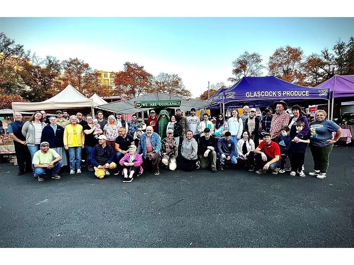 Vendors from last year's Reston Farmers Market pose for a photo in the Lake Anne Village parking lot, located at 1609 Washington Plaza N. in Reston.
