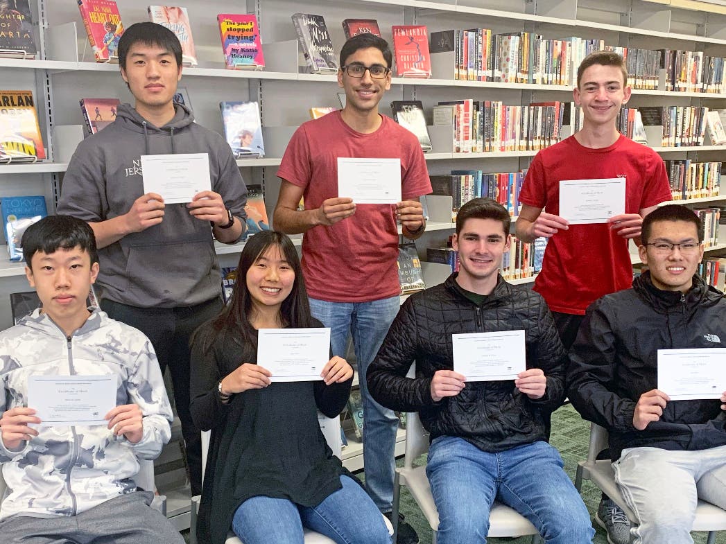 Shown after receiving their certificates are (back row) Andrew Qian, Shourya Bansal and Daniel Siegal; (front row) Arthur Zang, Kate Pun, Joshua Faber and Alan Wu. Kush Vachher also advanced in the competition, but was not available for the photo.  