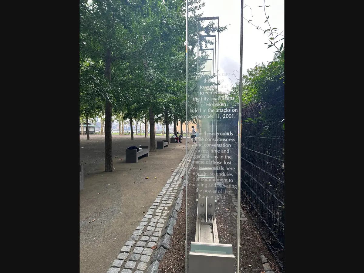 Those viewing Hoboken's 9/11 memorial sculpture can also see the new World Trade Center in the distance.