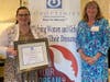 Alexis Wallace accepted the Community Partner of the Year Award on behalf of Penn Community Bank Foundation from SIIR Club President Kathy Waddington.