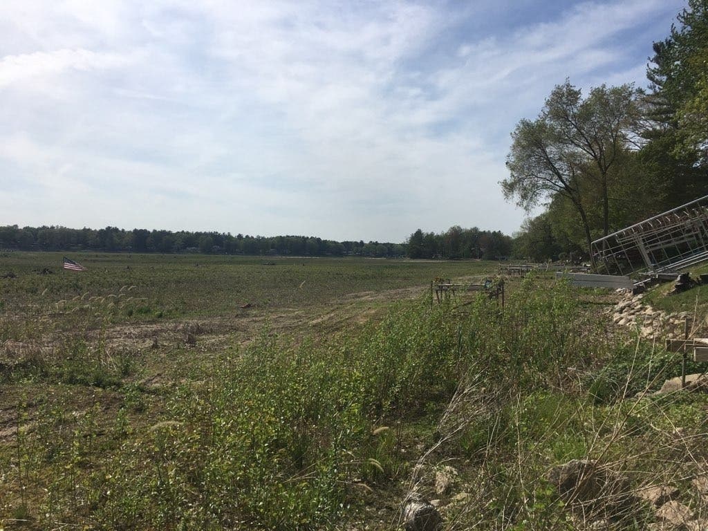 What was once Sanford Lake in mid-Michigan is pictured Tuesday. Wednesday marks one year since two dams failed, causing widespread flooding and the emptying of Sanford Lake. 