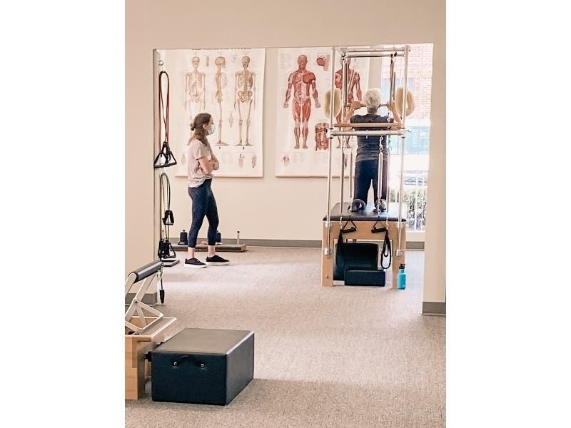 Instructor Katie Konstant works with a client at Swan Dive Center For Pilates in Northbrook. 