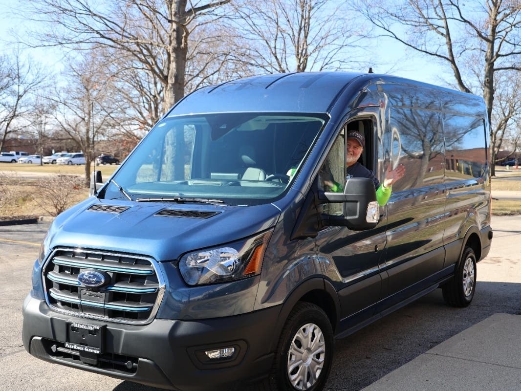 Facility maintenance worker John "J.D." Hoffman is shown at the wheel of the new vehicle. 