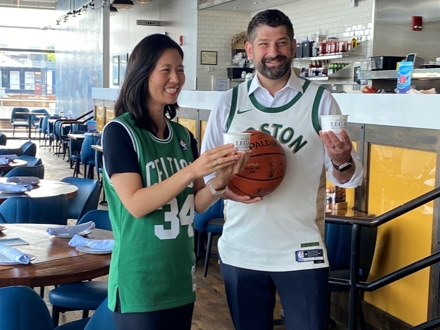 Boston Mayor Michelle Wu poses with Legal Sea Foods’ President and COO Matt King. As part of a friendly wager with Dallas Mayor Eric Johnson, Legal Sea Foods will send chowder and lobster rolls to Dallas should the Mavericks win the NBA Finals.