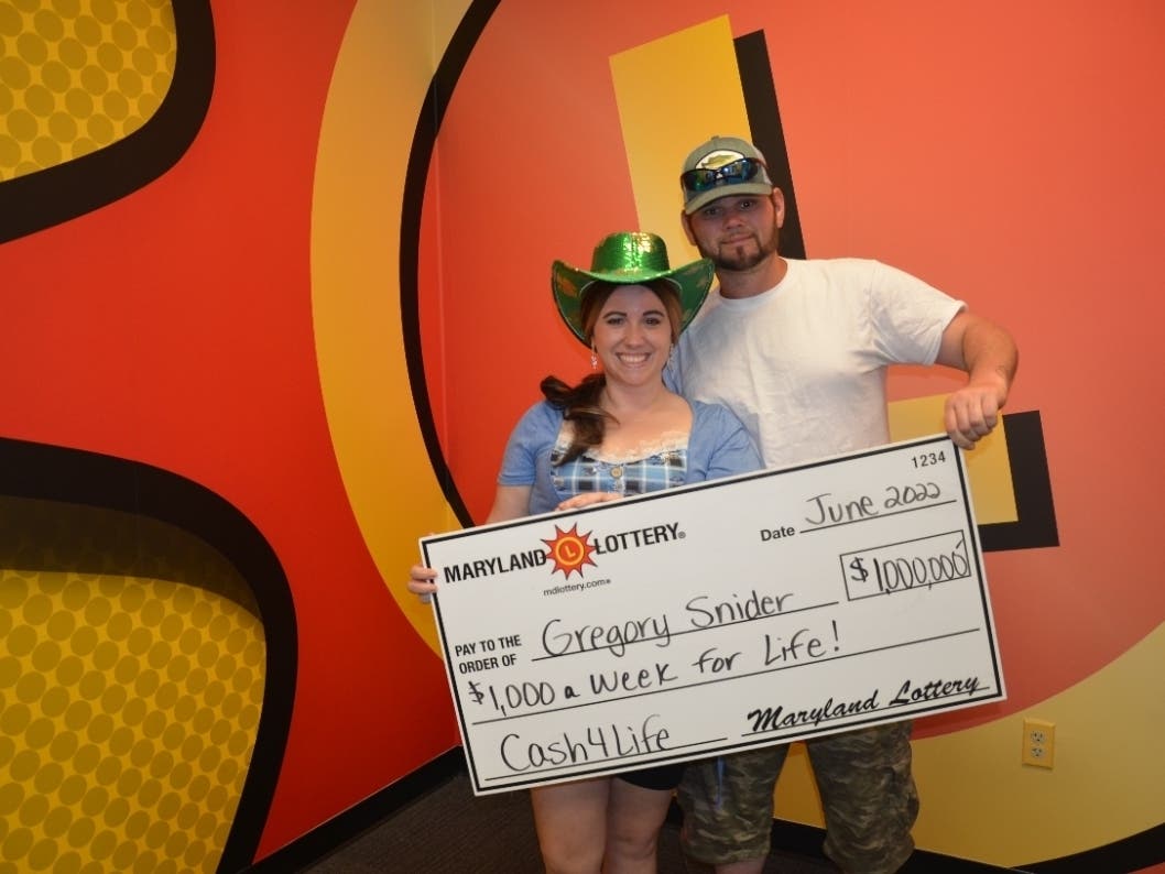 The Maryland Lottery announced that a 33-year-old heavy equipment operator won $1 million playing Cash4Life in Millersville on June 15. The winner, Gregory Snider, is pictured above holding a victory check with his wife, Sarah Brown.