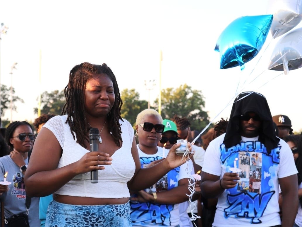 Aleia Commodore, holding balloons, wishes she had more time with her late friend, Isaiah Olugbemi. The 27-year-old father and soon-to-be professional boxer was fatally shot on June 17 in Odenton.