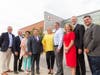 South Shore YMCA President & CEO Paul Gorman, Christine Koch, Quincy Mayor Thomas Koch, Karen and Rob Hale, Lauren Baker and Governor Charlie Baker, and SSYMCA Executive Board Chair, James Dunphy stand before the newly dedicated Hale Family Y