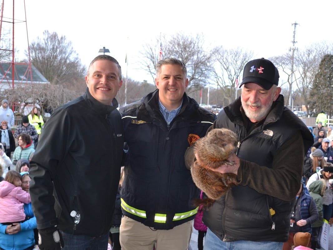 Holtsville Hal and his human stewards, Brookhaven Town Clerk Kevin LaValle, Greg Drossel, his handler, and Brookhaven Highways Supt. Dan Losquadro.