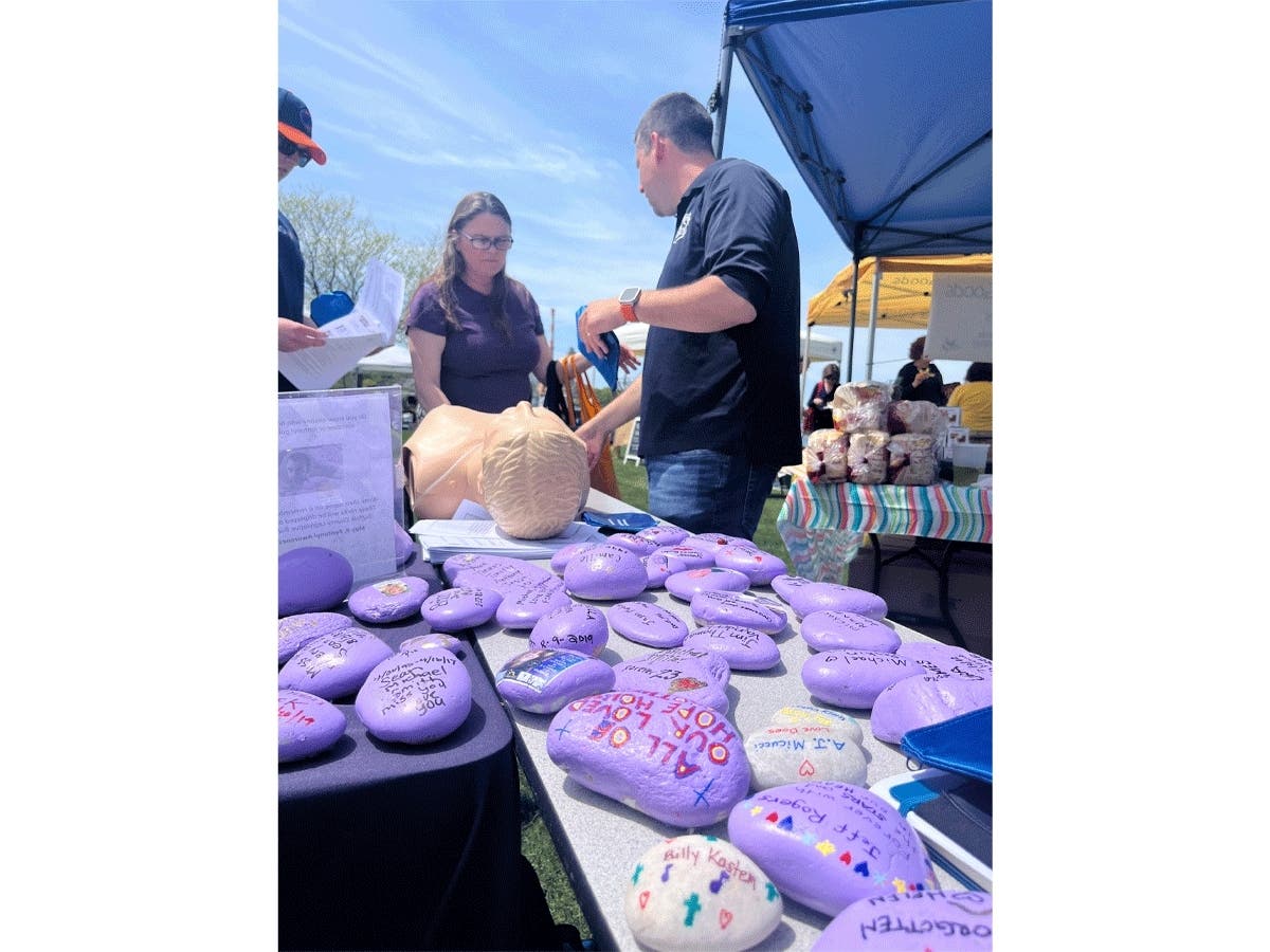 Suffolk Police Emergency Medical Services trainer Jason Byron demonstrating the administration of Narcan at the Port Jefferson Farmer's Market in May.