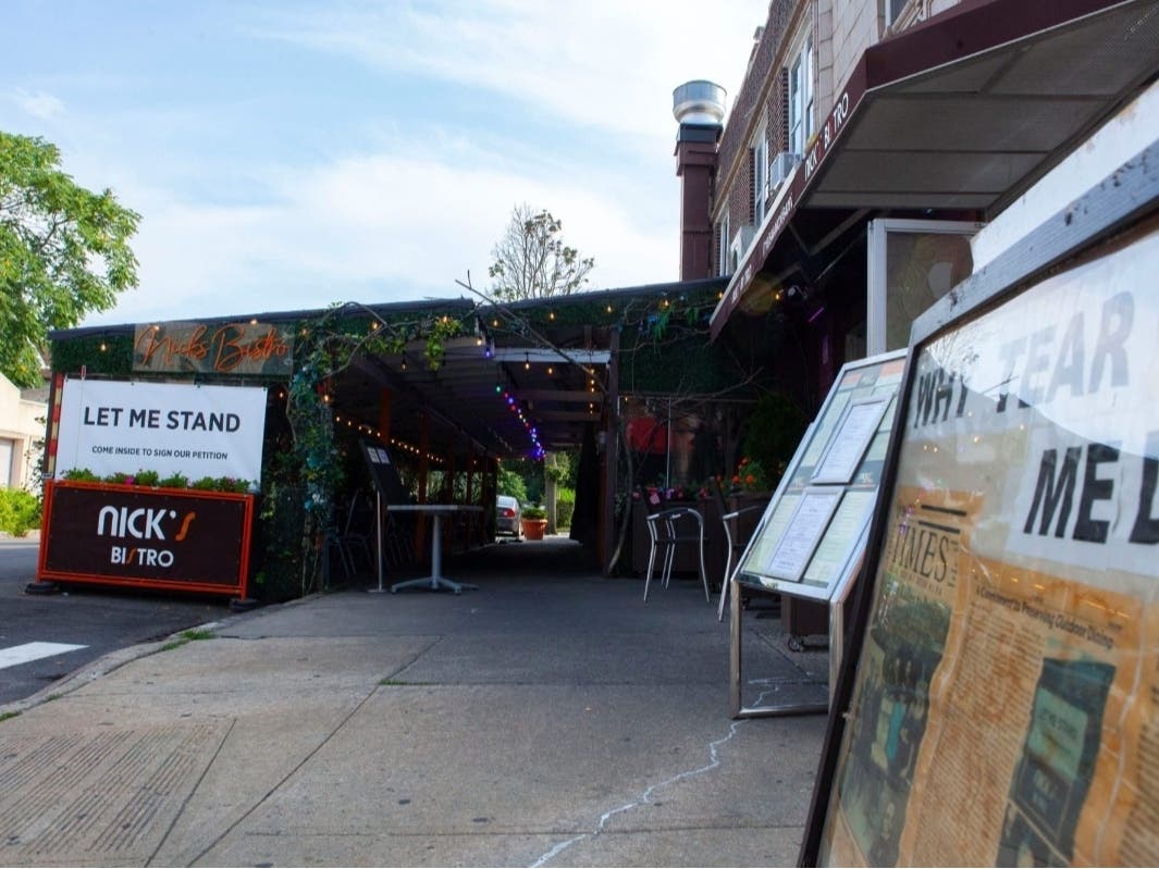 Nick’s Bistro in Forest Hills advertised a petition to keep up original outdoor dining sheds, Aug. 5, 2024.