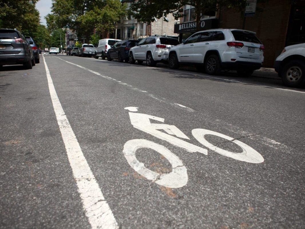 An unprotected bike lane on Kingston Avenue north of Eastern Parkway in Crown Heights, Aug. 5, 2024.