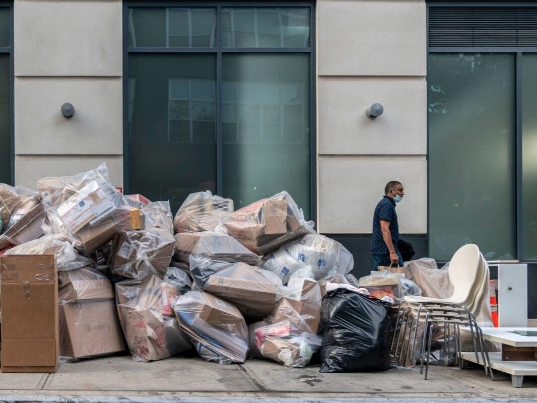 Piles of trash line a street in downtown Brooklyn, Sept. 25, 2020.