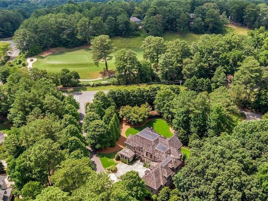 This home for sale in Alpharetta costs $1,725,000, and has a spa-like bathroom, billiard room, gym, powder room, and a second primary suite.