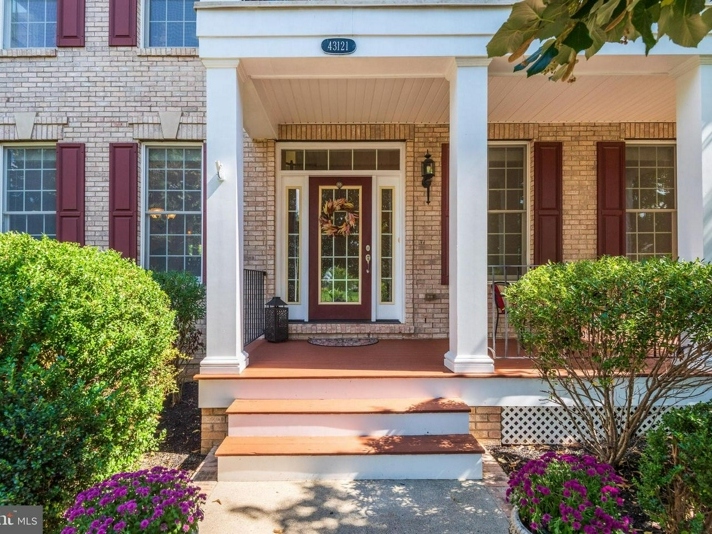 A home for sale in Ashburn's Loudoun Valley Estates includes a spacious recreation room, a stone patio with a fire pit, and more upgrades. 