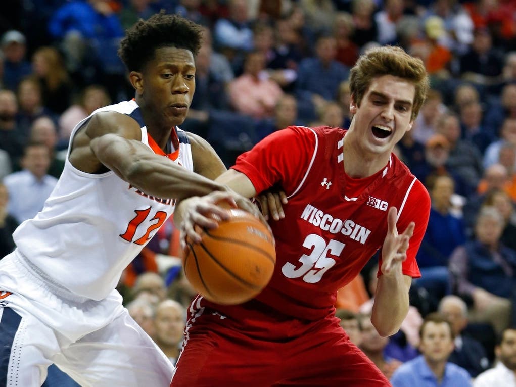 Former Wisconsin basketball player Nate Reuvers, right, starred at Lakeville North before playing for the Badgers. He spent last season playing professionally for Cibona in Croatia. 