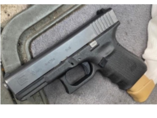 A 9mm Glock handgun, with 17 rounds in an extended magazine, was found by police. 