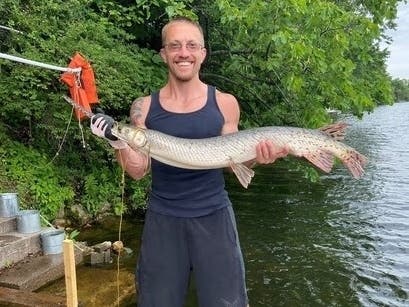 Chuck Zimmerman, of Hilton, hooked the huge longnose gar on Butterfield Lake in Jefferson County while fishing with friends during an annual weeklong trip.