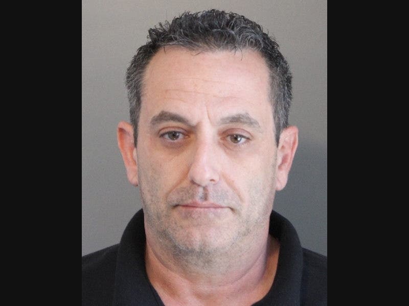 Raymond Sgambati is charged with third-degree burglary and third-degree attempted arson, after a gas line was damaged at his Massapequa Park pizzeria, police said. 