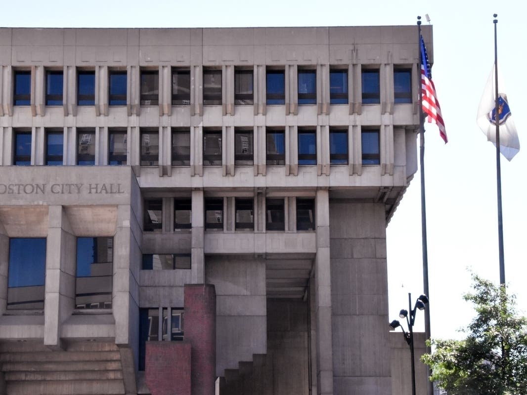 Boston City Hall has three flagpoles and leaves one available for private organizations. Over the last decade, the city has approved more than 280 flyings but has only rejected one - Camp Constitution's Christian flag.