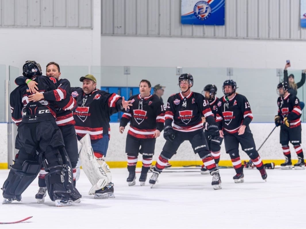 The New Jersey Warriors won the Tier V crown in the inaugural Toyota USA Hockey Warrior National Championship, which took place from April 11 through 14 at the Ice Vault Arena in Wayne Township. Here, they celebrate with a hug for goalie Brian Shaw. 