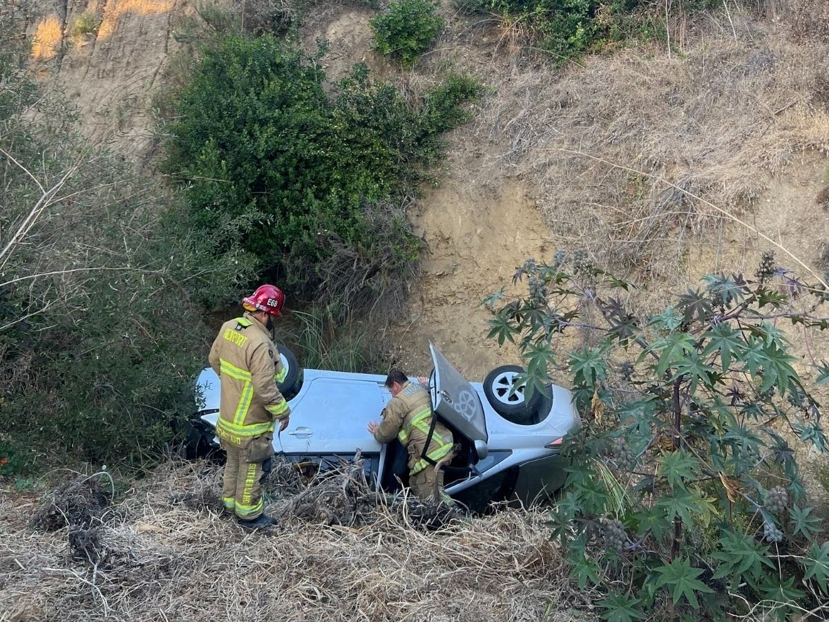 Car Careens Off 50 Foot Cliff, Occupants Rescued Thanks To NBFD