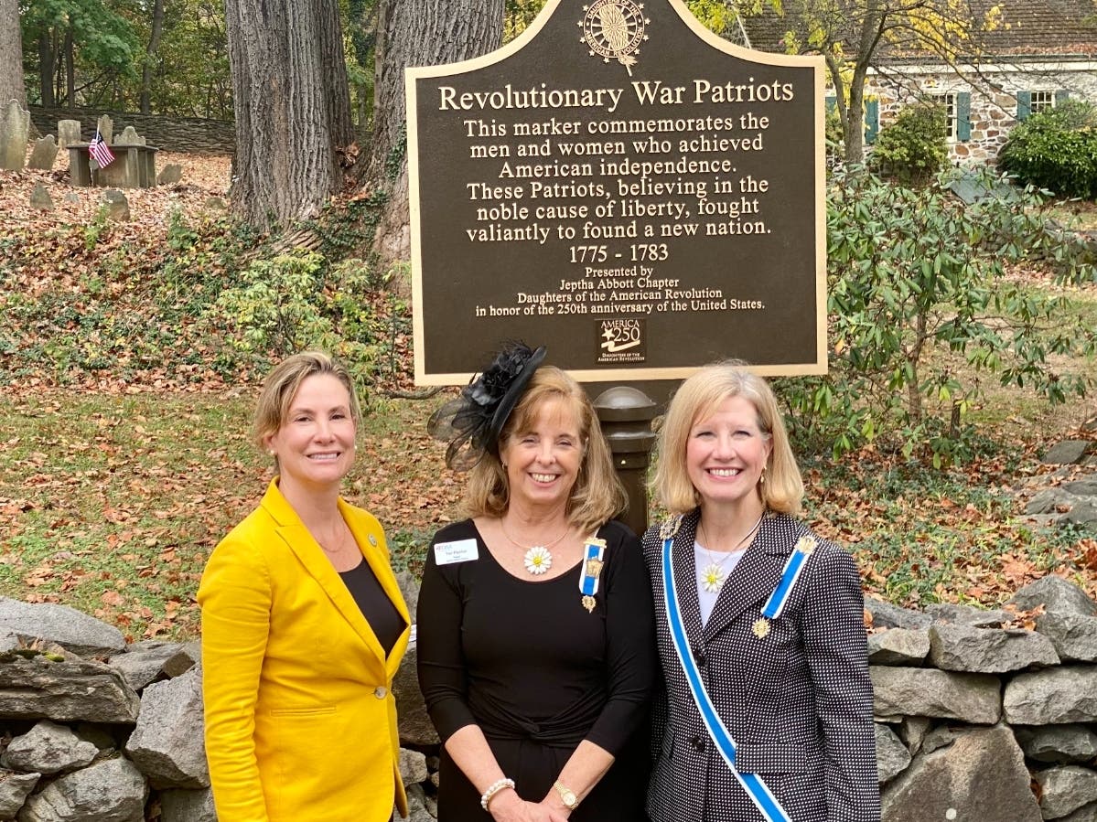 Chester County Commissioner Michelle Kichline, Jeptha Abbott DAR Regent Teri Fischer, and DAR State Regent Marguerite Fritsch participate Sunday in a ceremony to place a marker at the historic Old Eagle School Cemetery.