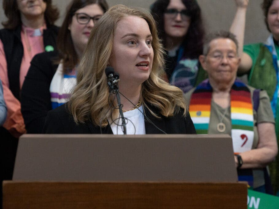 State Sen. Megan Hunt of Omaha speaks against further restrictions at a rally on Wednesday, April 12, 2023, in Lincoln, Neb.