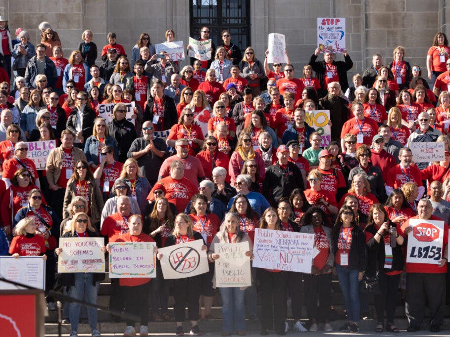 Parents, educators, school leaders and members of the public flood the steps of the Nebraska State Capitol in support of public schools and against an “opportunity scholarships” measure on Saturday, April 29, 2023, in Lincoln, Neb.