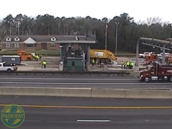 New Jersey Department of Transportation cameras show the truck stuck in the booth still as of 10 a.m.