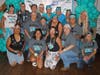 Ovarian cancer survivors' annual photo on 7/14/24. Includes JuliAnne Scully (back, second from right), 2023 recipient Rosie T. (front, second from left), and 2019 recipient Jillian M., celebrating her five-year anniversary (front, second from right.)