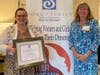 Alexis Wallace accepted the Community Partner of the Year Award on behalf of Penn Community Bank Foundation from SIIR Club President Kathy Waddington.