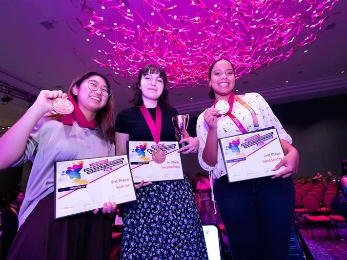 Avery Blanchard (center) produced an ambitious video game design on Adobe platforms that won her the national award on Wednesday.  Susie Lee (left), the 3rd-place winner, and Salma Sanchez (right), the 2nd-place winner, are also pictured. 