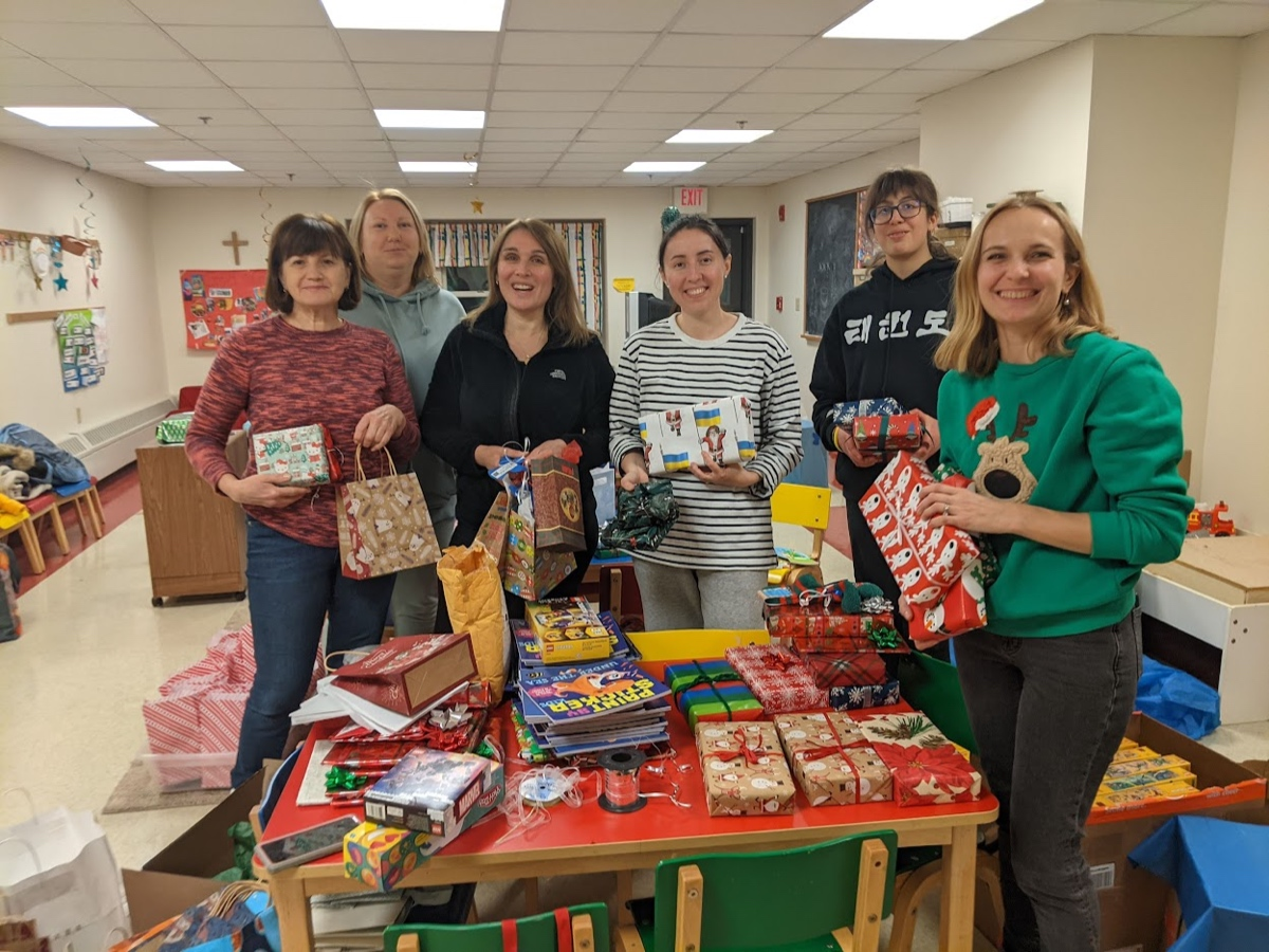 Pictured are volunteers Nadia Stakhyra,  Vika Okara-Pravdenko, Tanya Kornyat, Natalia Pasichniak, Natalie Sirotkin, Lyubov Ferara, who wrapped gifts to give to Ukrainian refugee children at an upcoming holiday party.