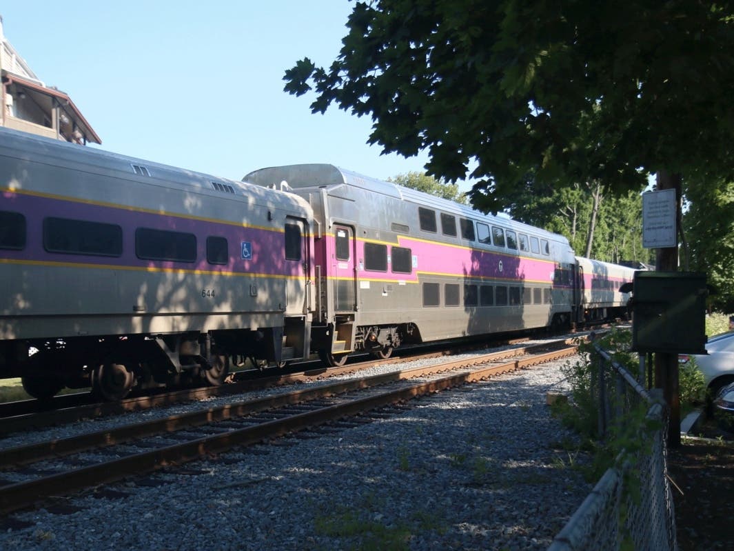 A Commuter Rail train passes through Melrose. Trains will continue operating between Reading and North Station during planned disruptions that will see shuttle buses take over service between Reading and Haverhill over the coming months.